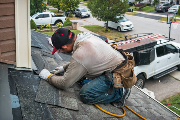 Professional Roofing technician working in Kesley, IA